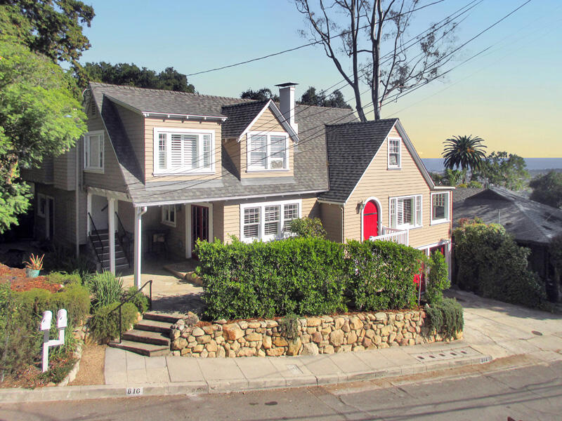 a view of house with yard