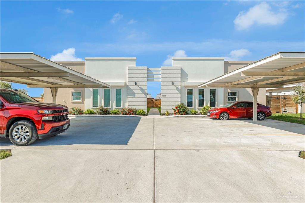 a front view of a building with parking