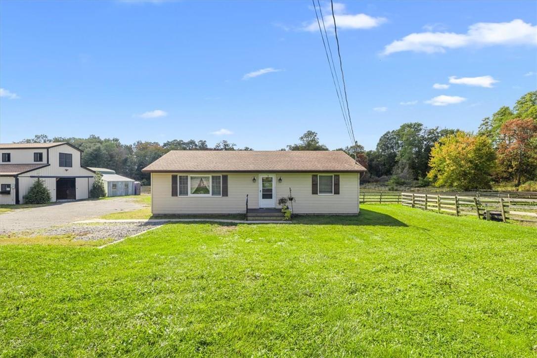 Front of house, barn and paddocks