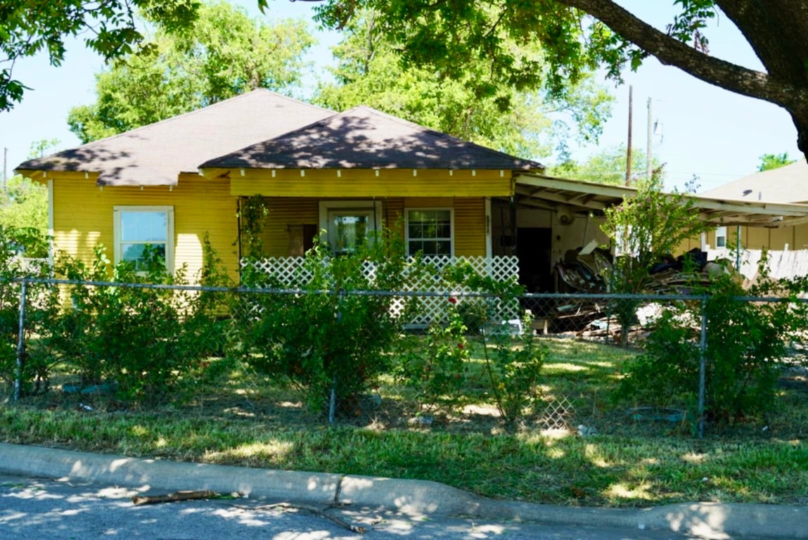 a view of a house with a garden