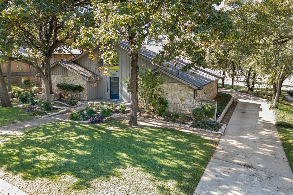 a backyard of a house with lots of green space