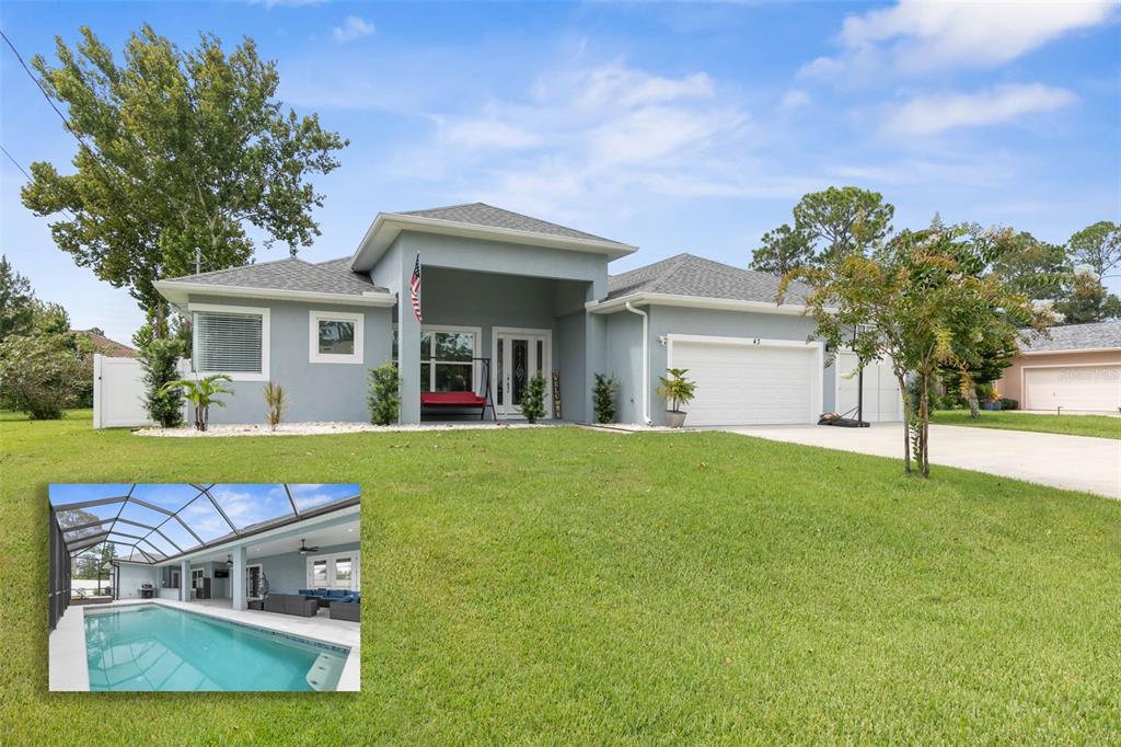 a view of a house with a backyard