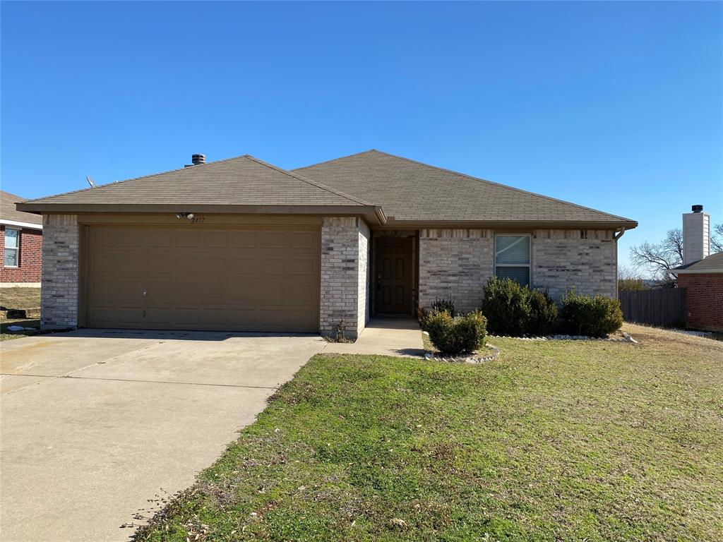 a front view of a house with yard