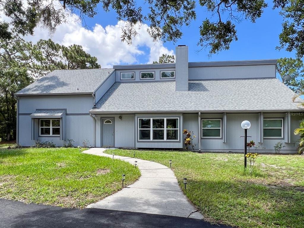 front view of a house with a yard