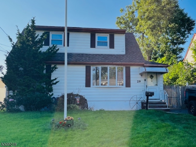 a view of a house with a backyard