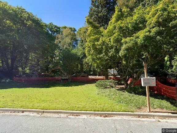 a view of backyard with small garden