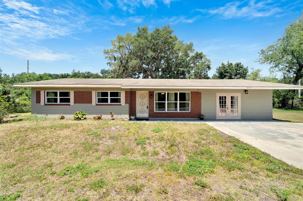 front view of a house with a yard