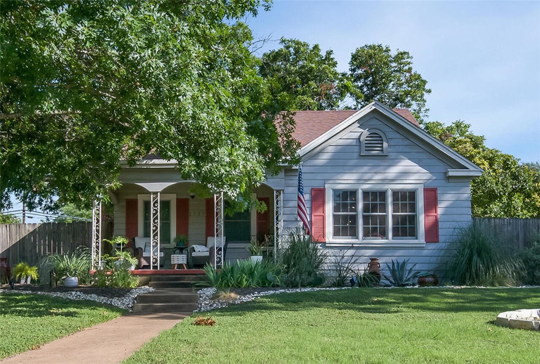 front view of a house with a yard