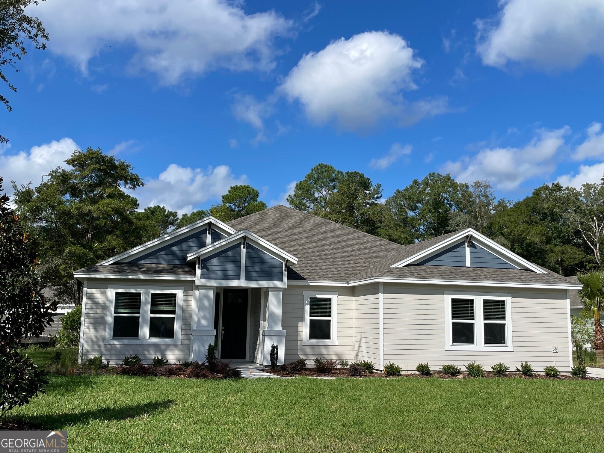 a front view of a house with a yard