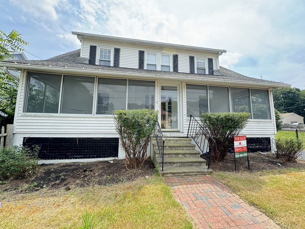 a front view of a house with a porch