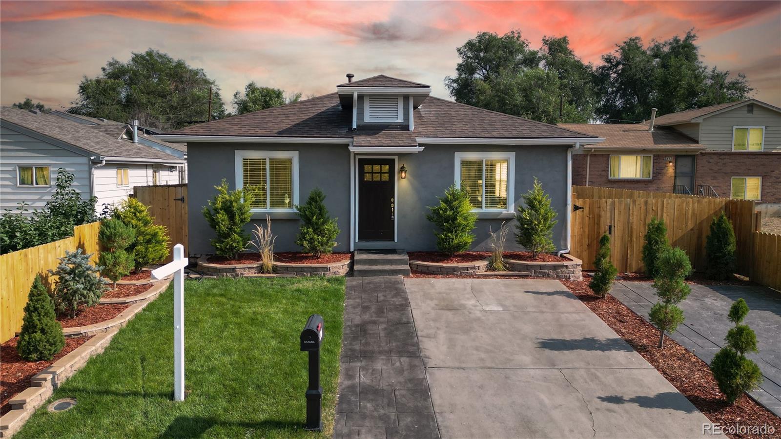 a view of a house with backyard sitting area and garden