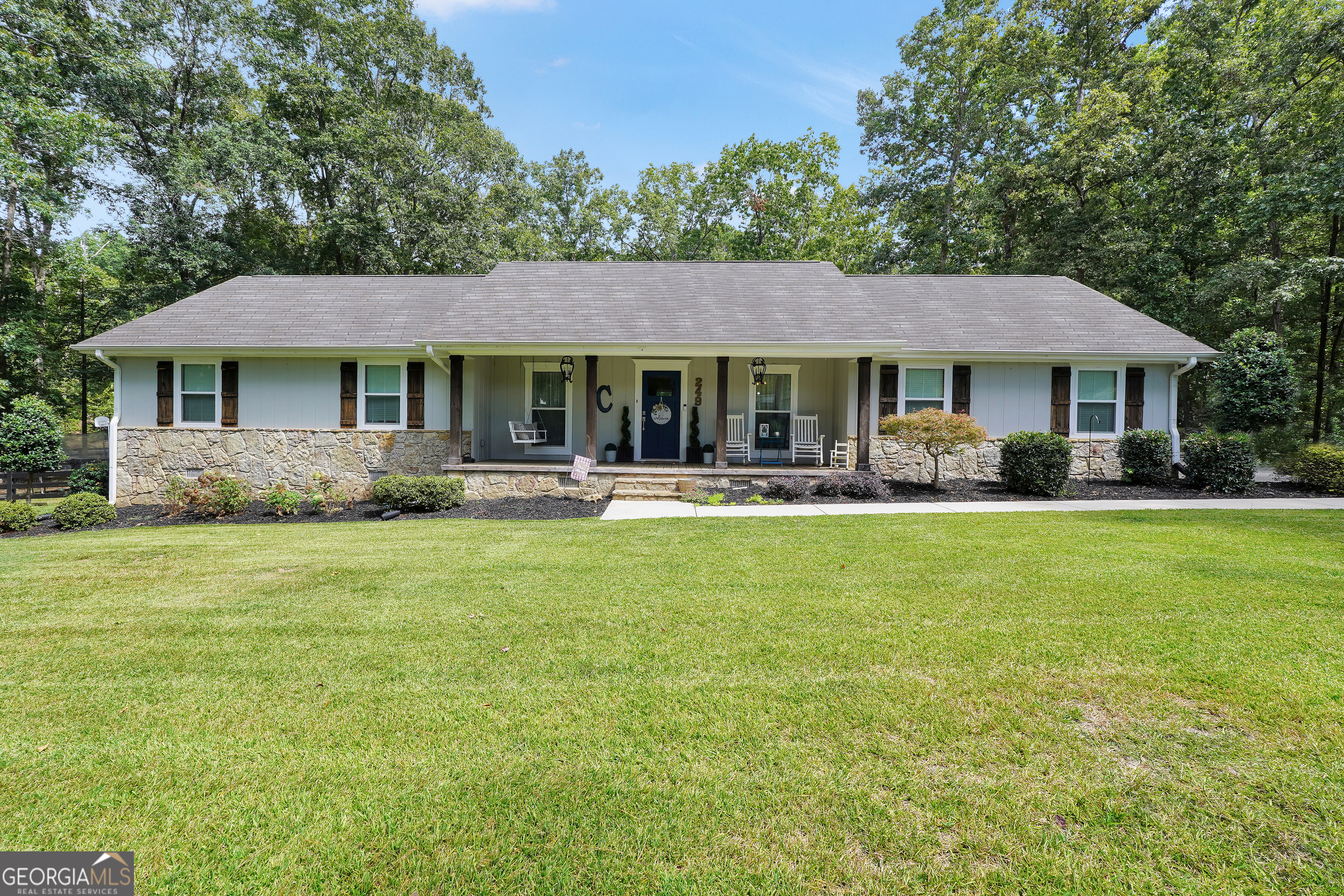 a front view of a house with a yard