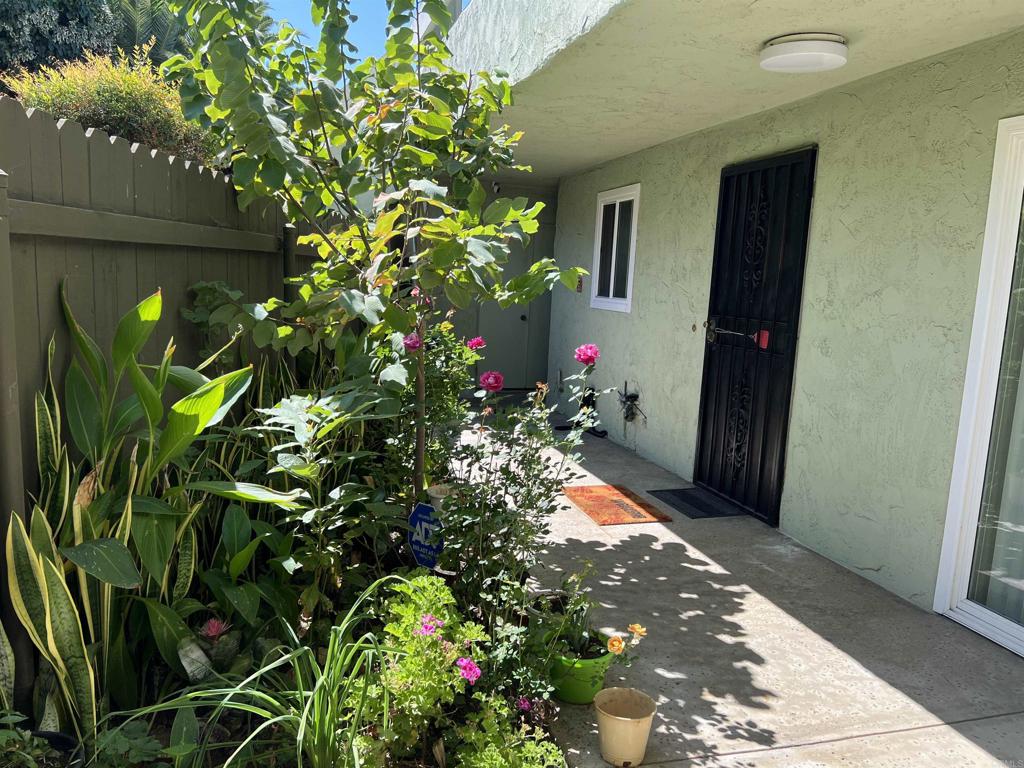 a view of a house with a flower garden