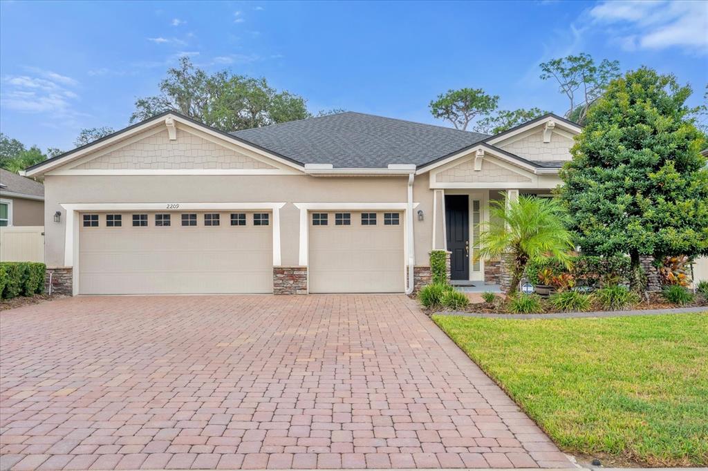 a view of a house with a yard