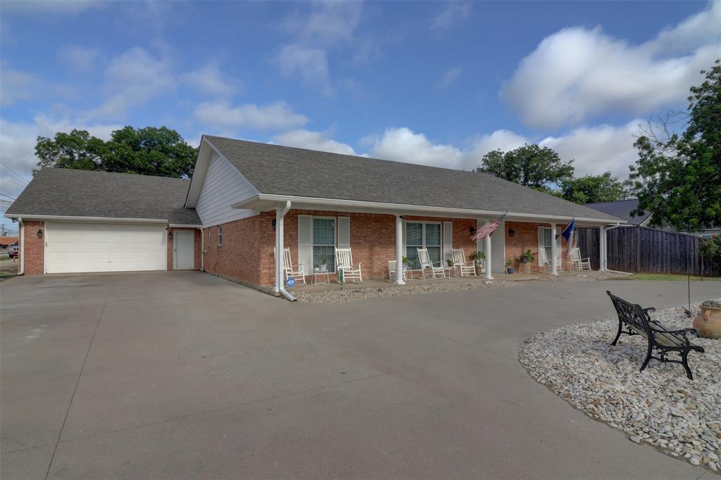 a front view of house with yard and seating space