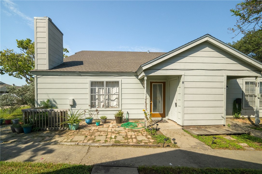 a view of house with yard