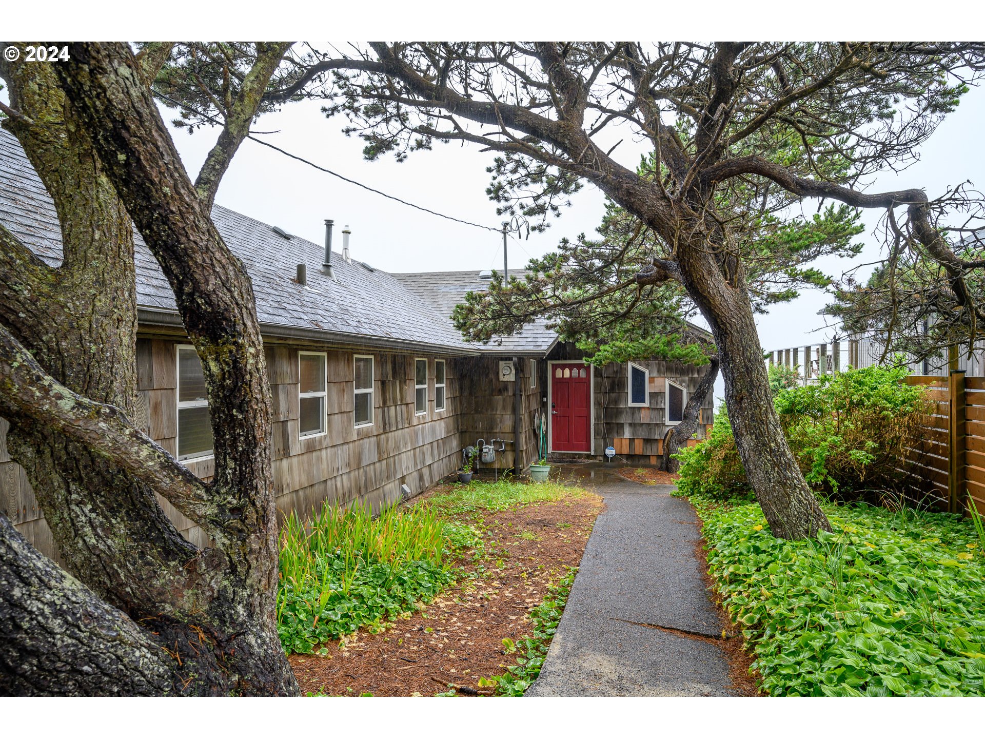 a front view of house with yard and green space