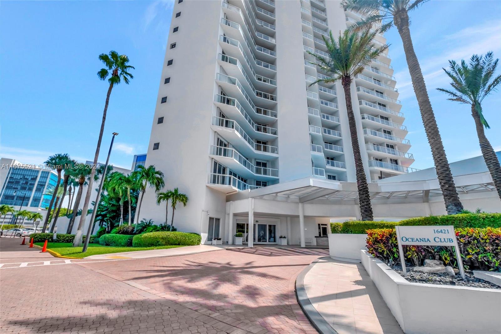 a view of a palm trees in front of a building