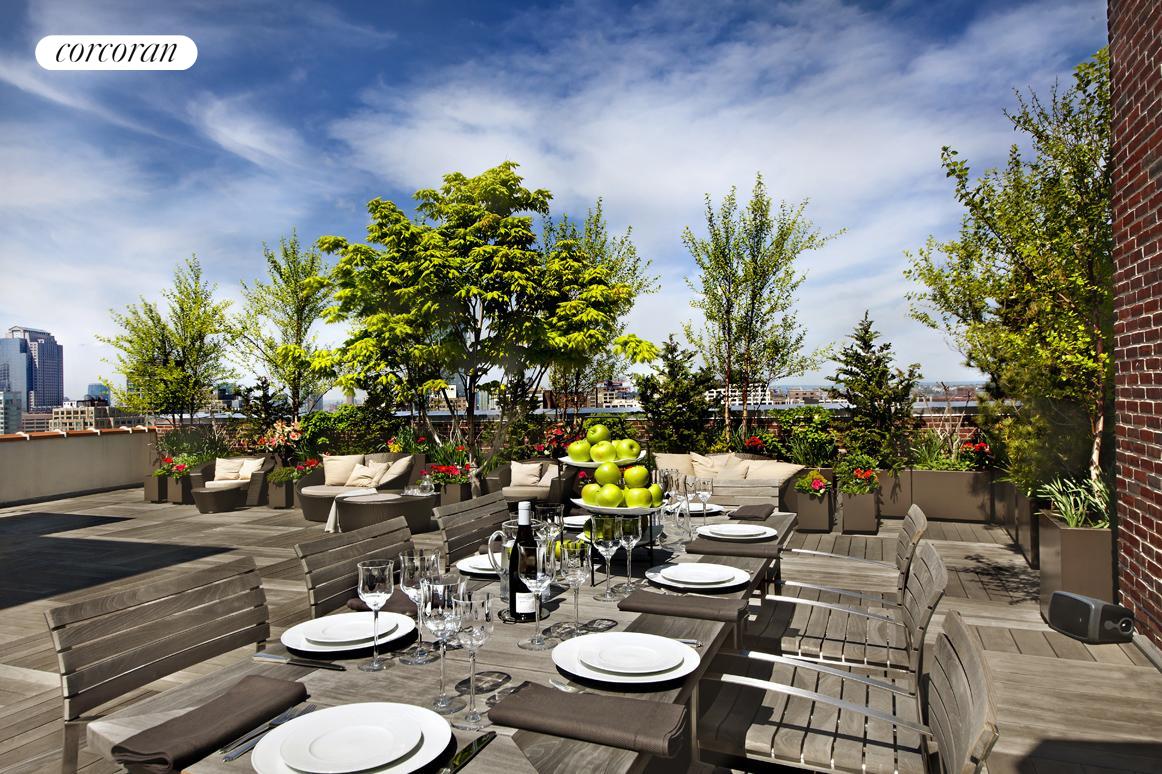 a backyard of a house with table and chairs with wooden floor and plants