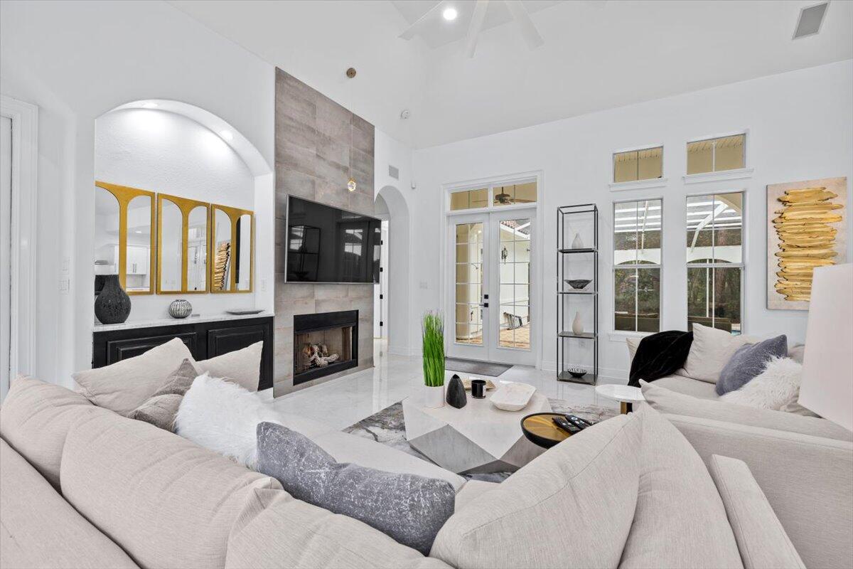 a living room with furniture fireplace and a flat screen tv