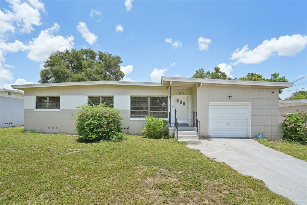 front view of a house with a yard