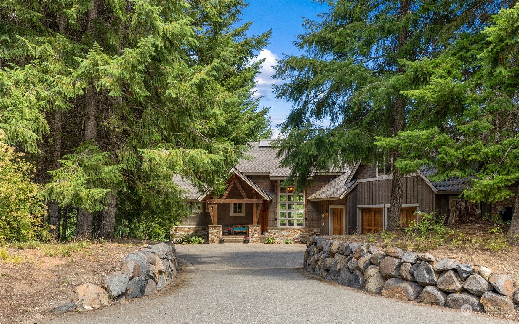 front view of a house with a tree