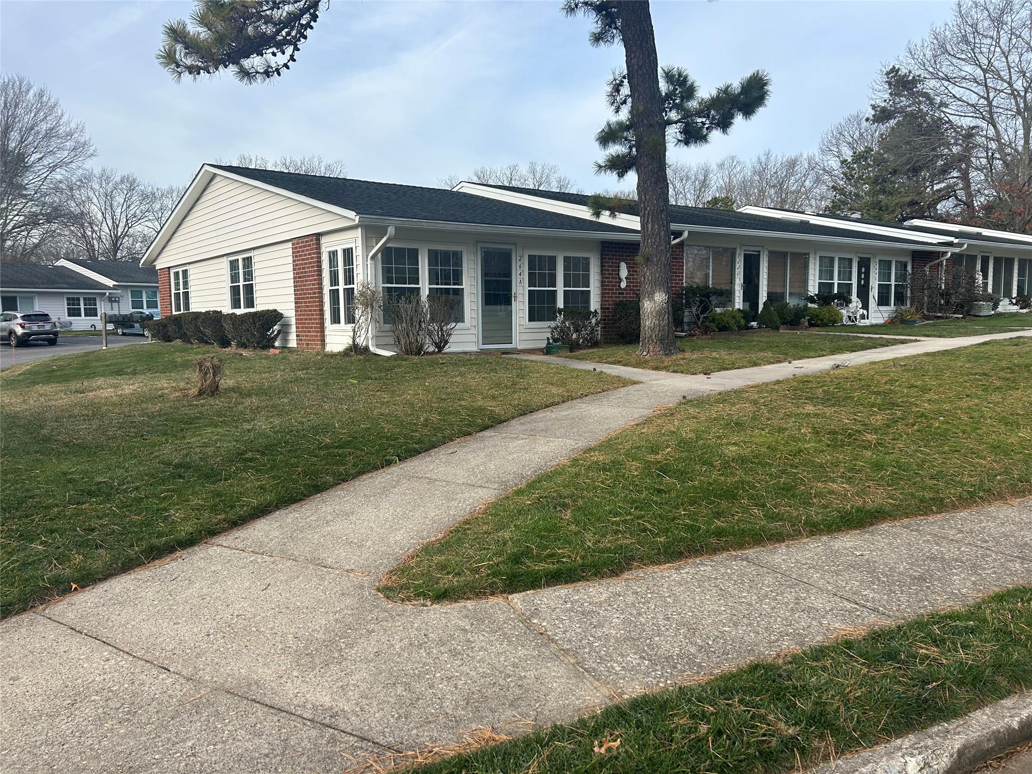 front view of a house and a yard