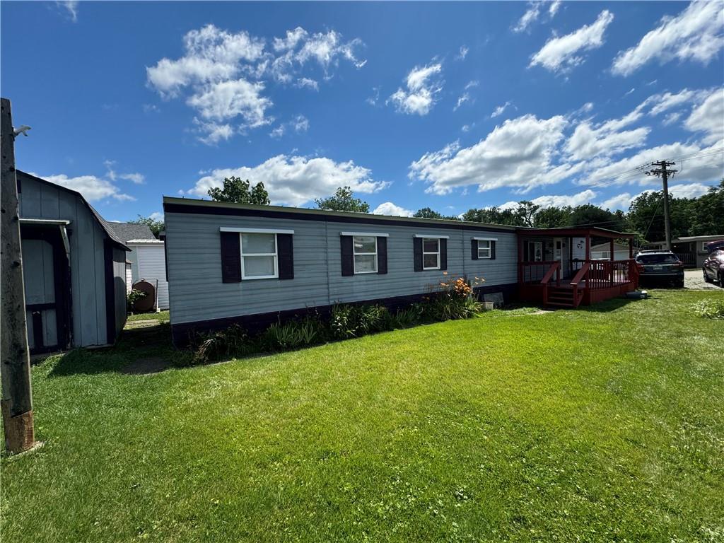 a view of a house with a backyard