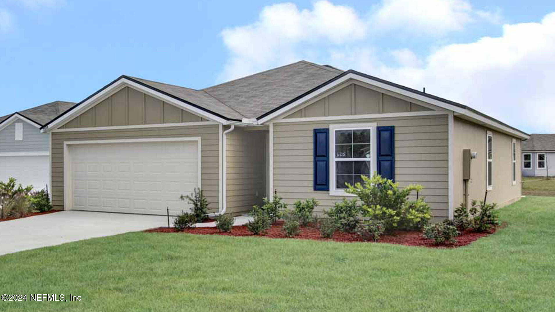 a view of a house with a yard and plants