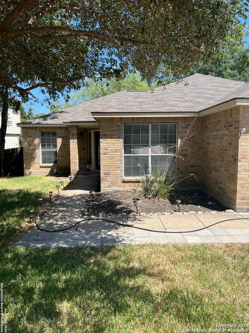 a backyard of a house with yard and garage