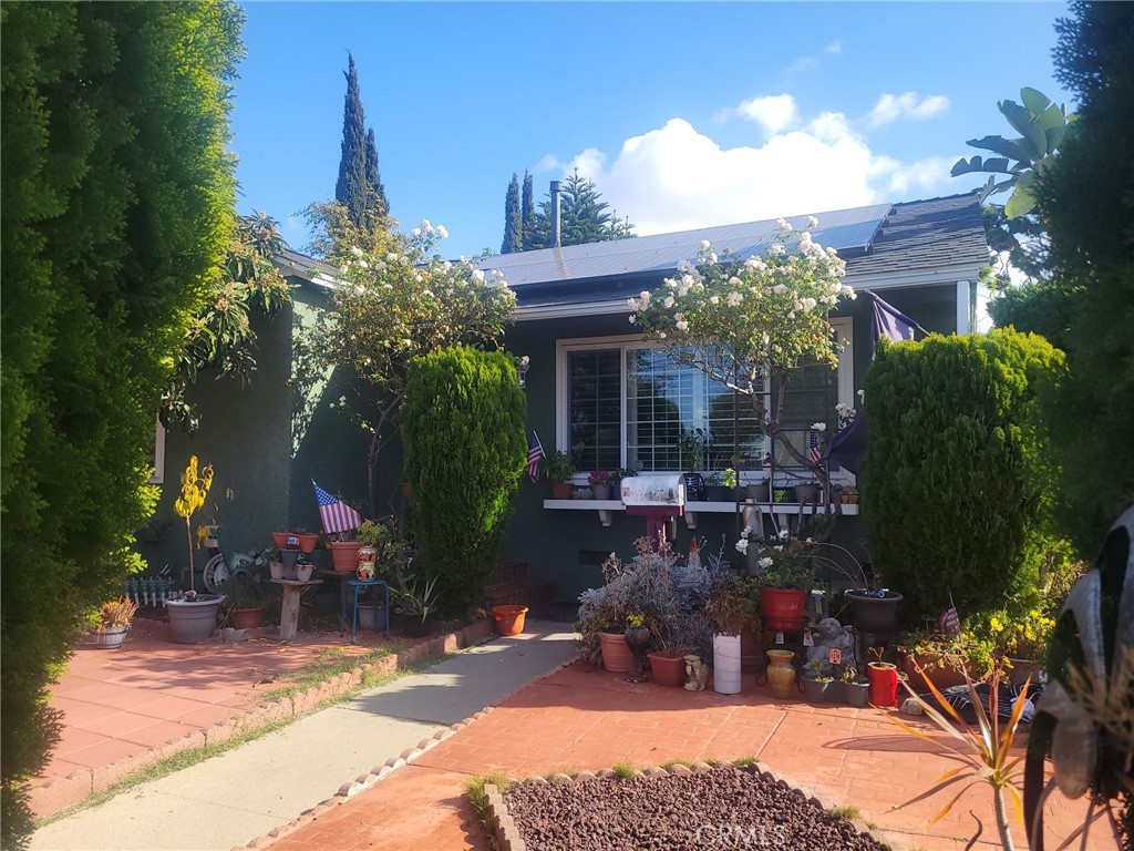 a view of house with outdoor space and sitting space