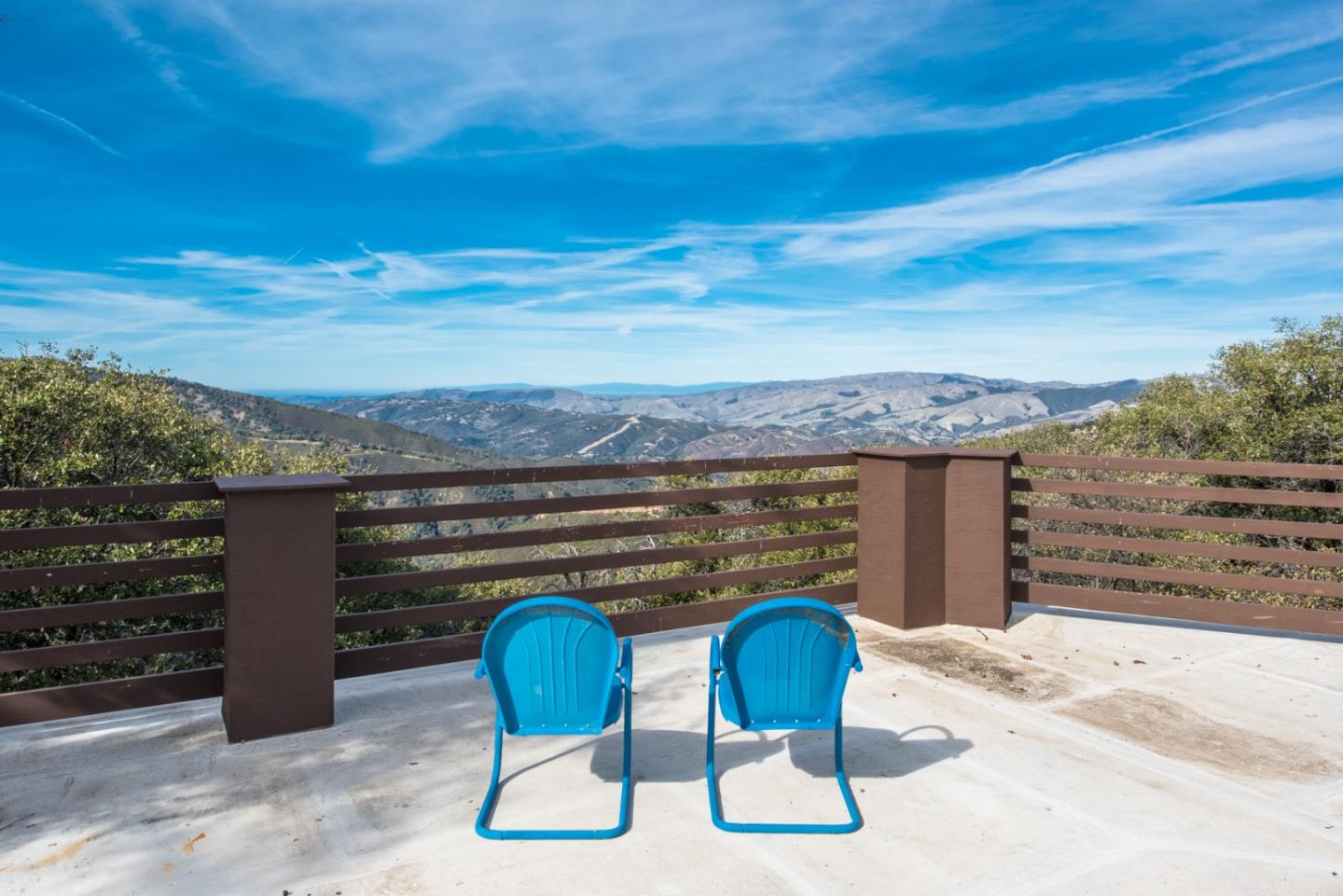 a view of an chairs and table in the patio