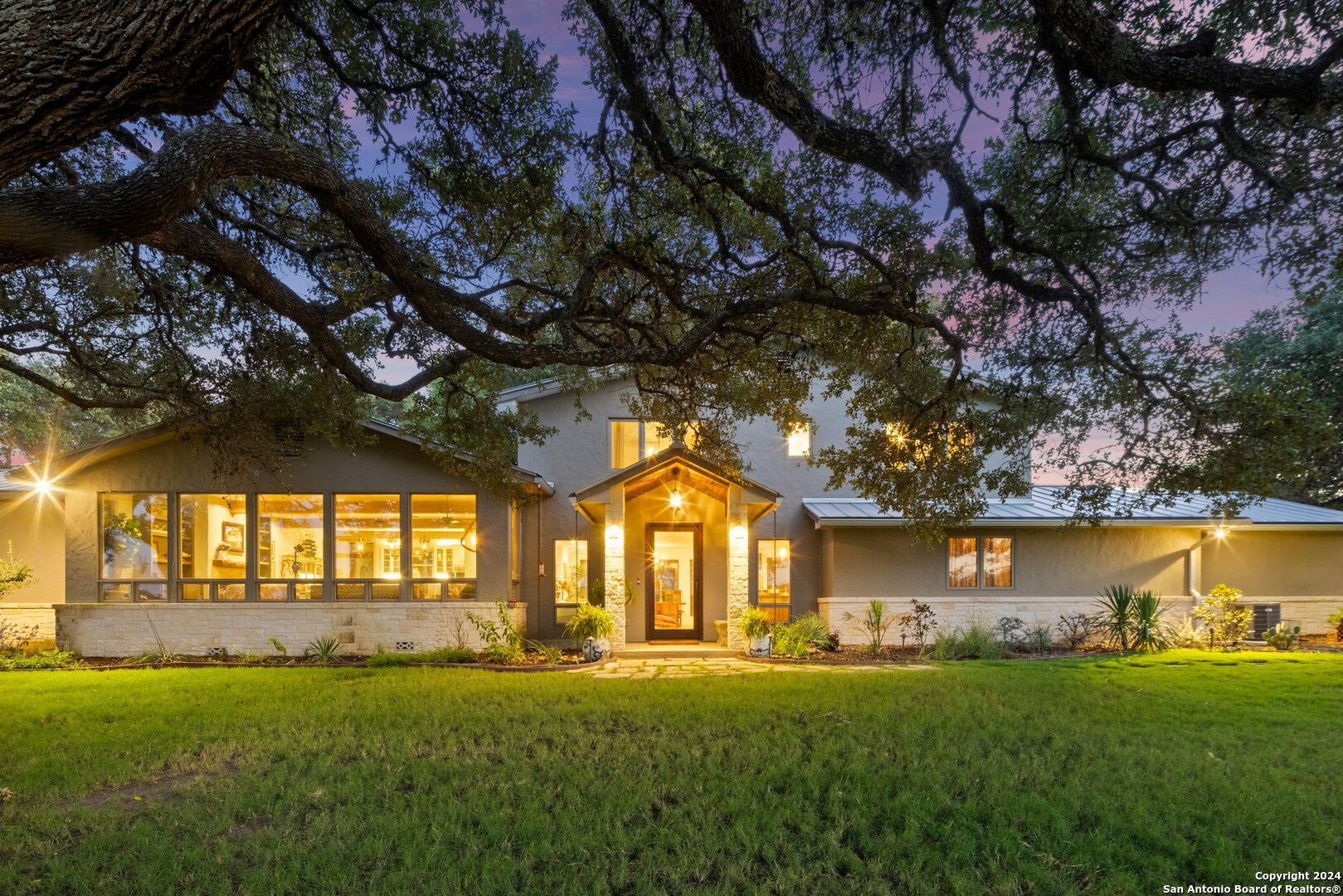 a front view of house with yard and green space