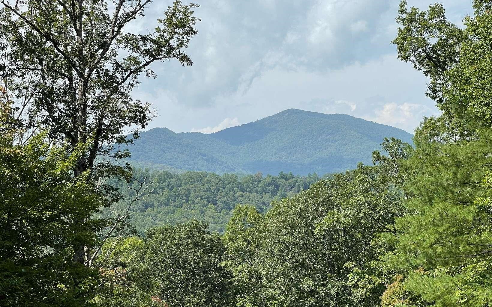 a view of mountains and valleys