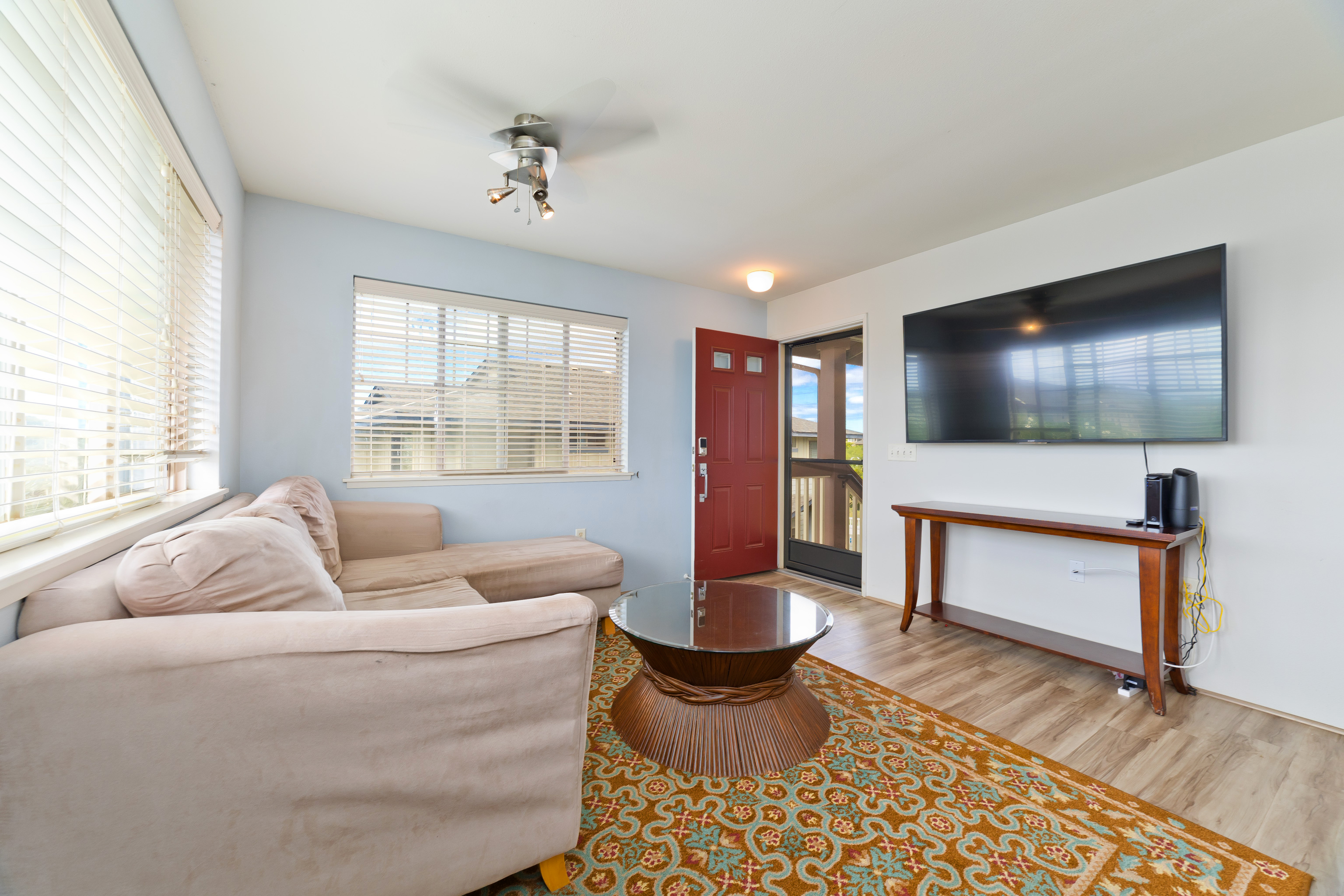 a living room with furniture and a flat screen tv