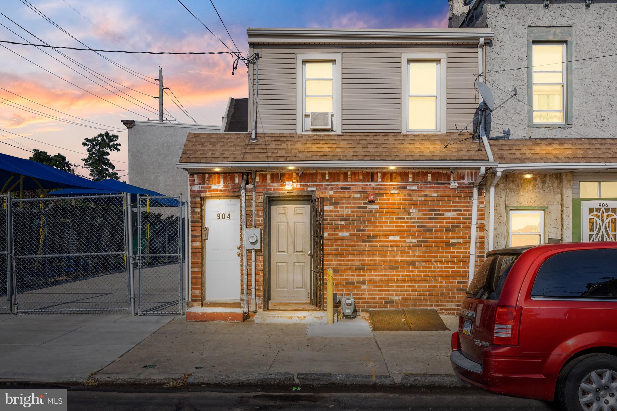 a front view of a house with a parking