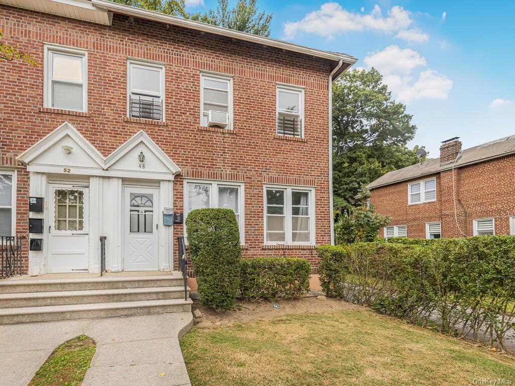 View of front of house with a front yard