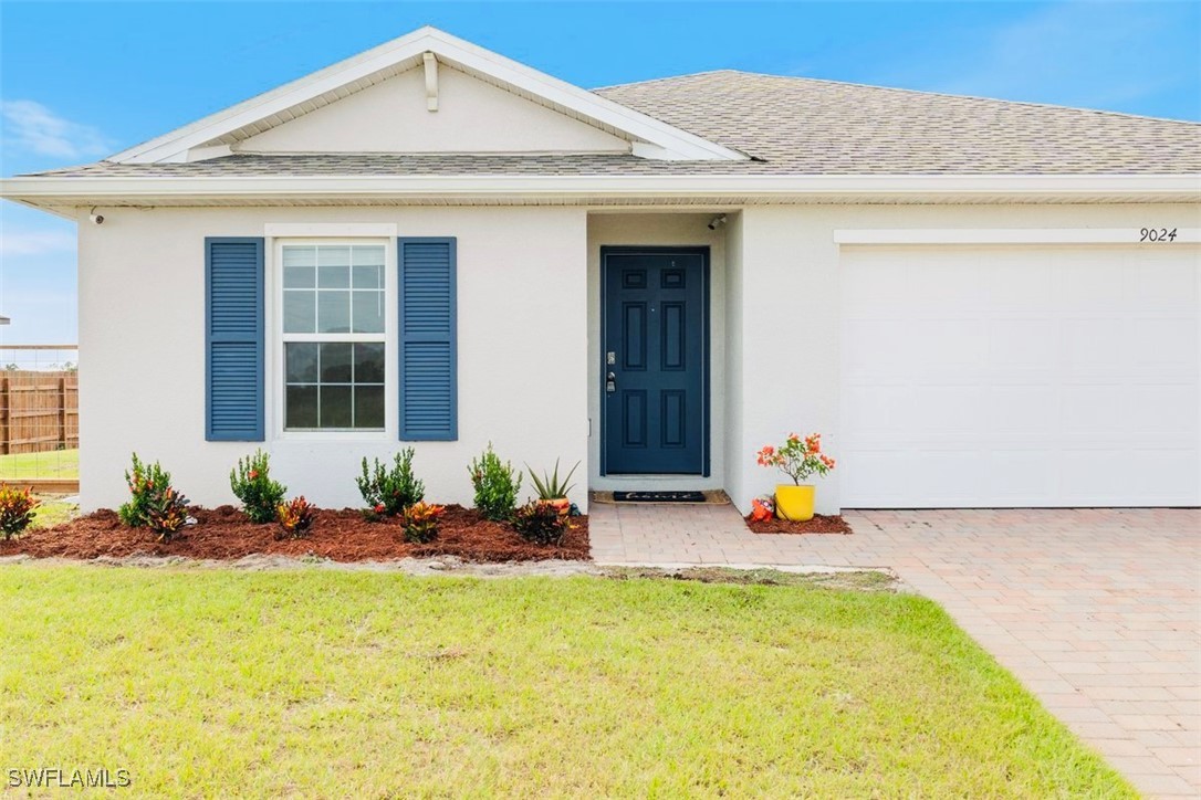 a front view of a house with a yard