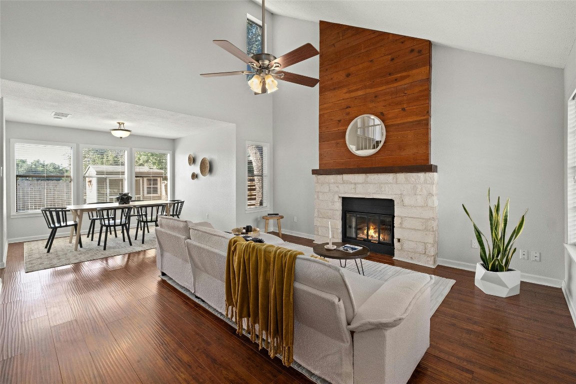 a living room with furniture and a fireplace