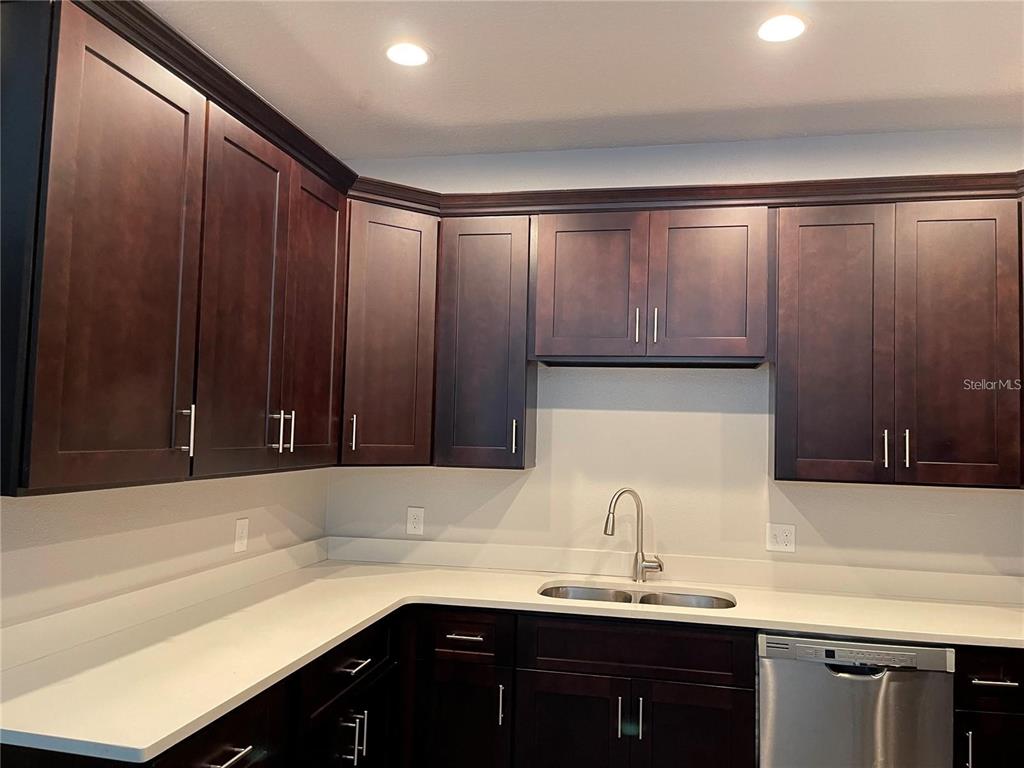 a kitchen with a sink and cabinets