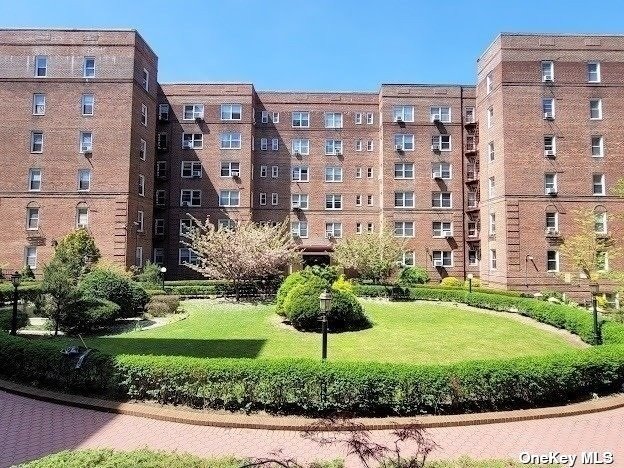 a view of a building with a yard