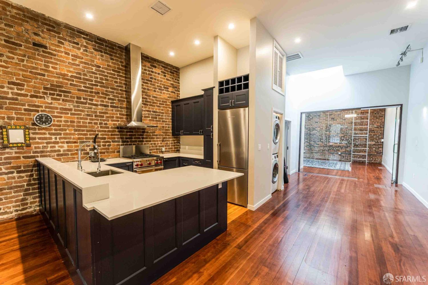 a kitchen with a sink stove and refrigerator