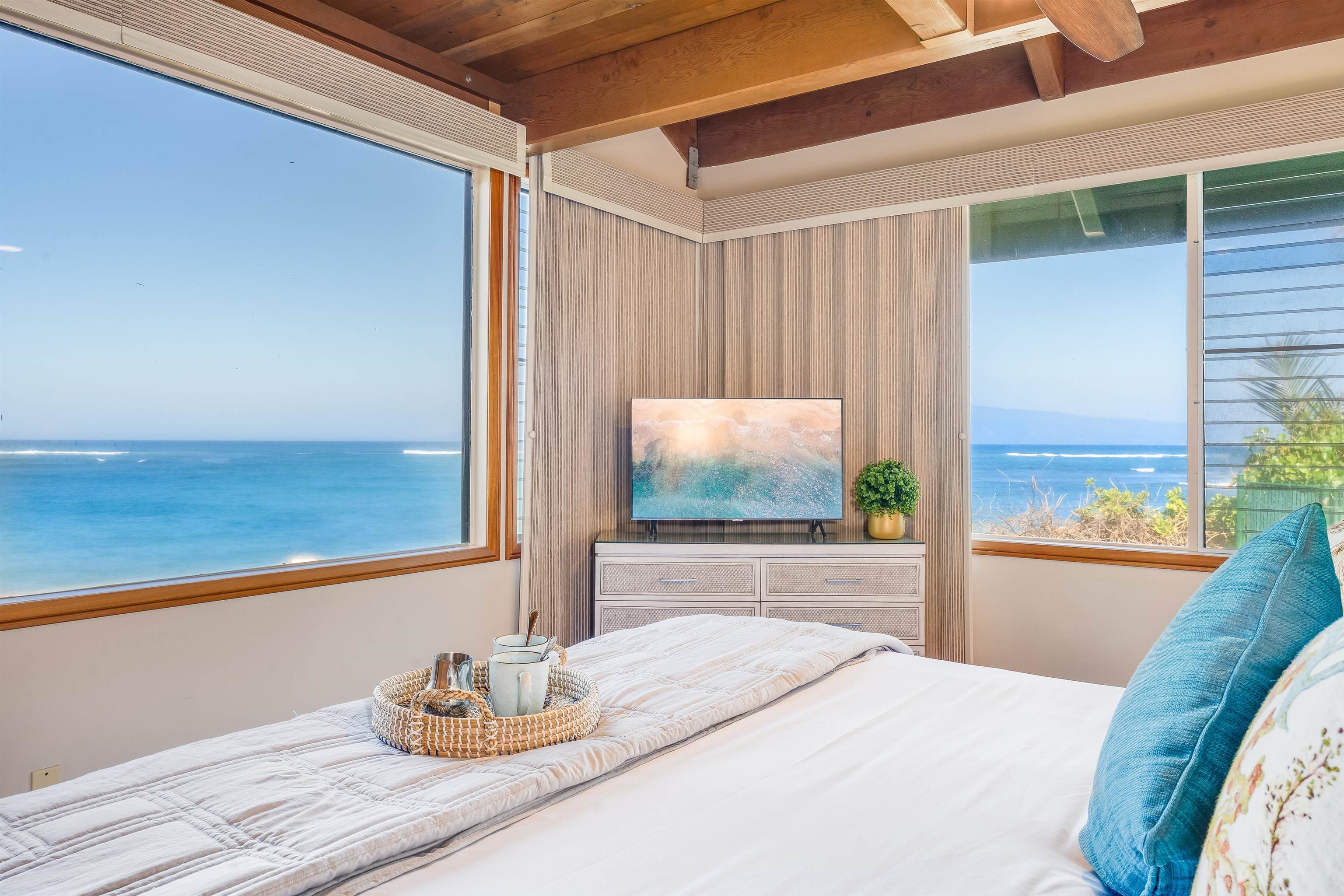 a bedroom with furniture and a flat screen tv