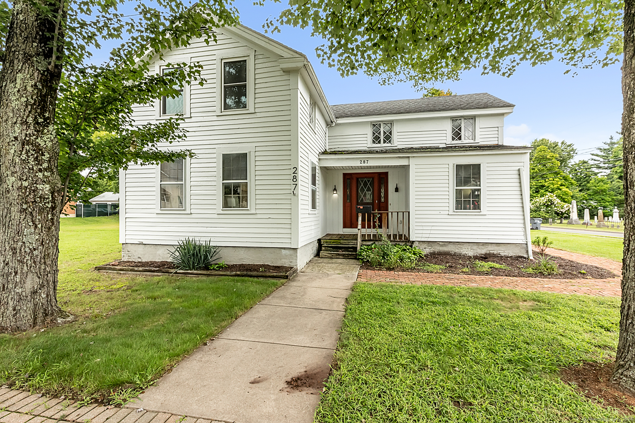 a front view of a house with a yard