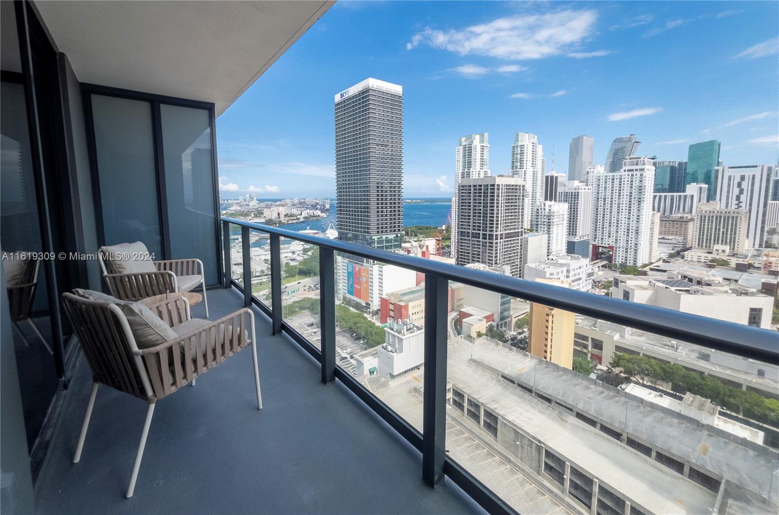 a view of roof deck with furniture