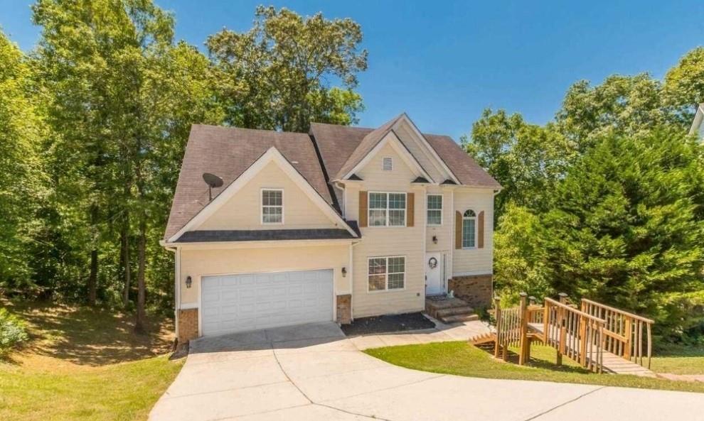 a front view of a house with a yard