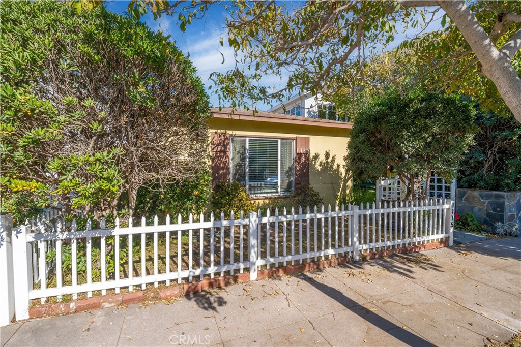 a view of a house with a small yard