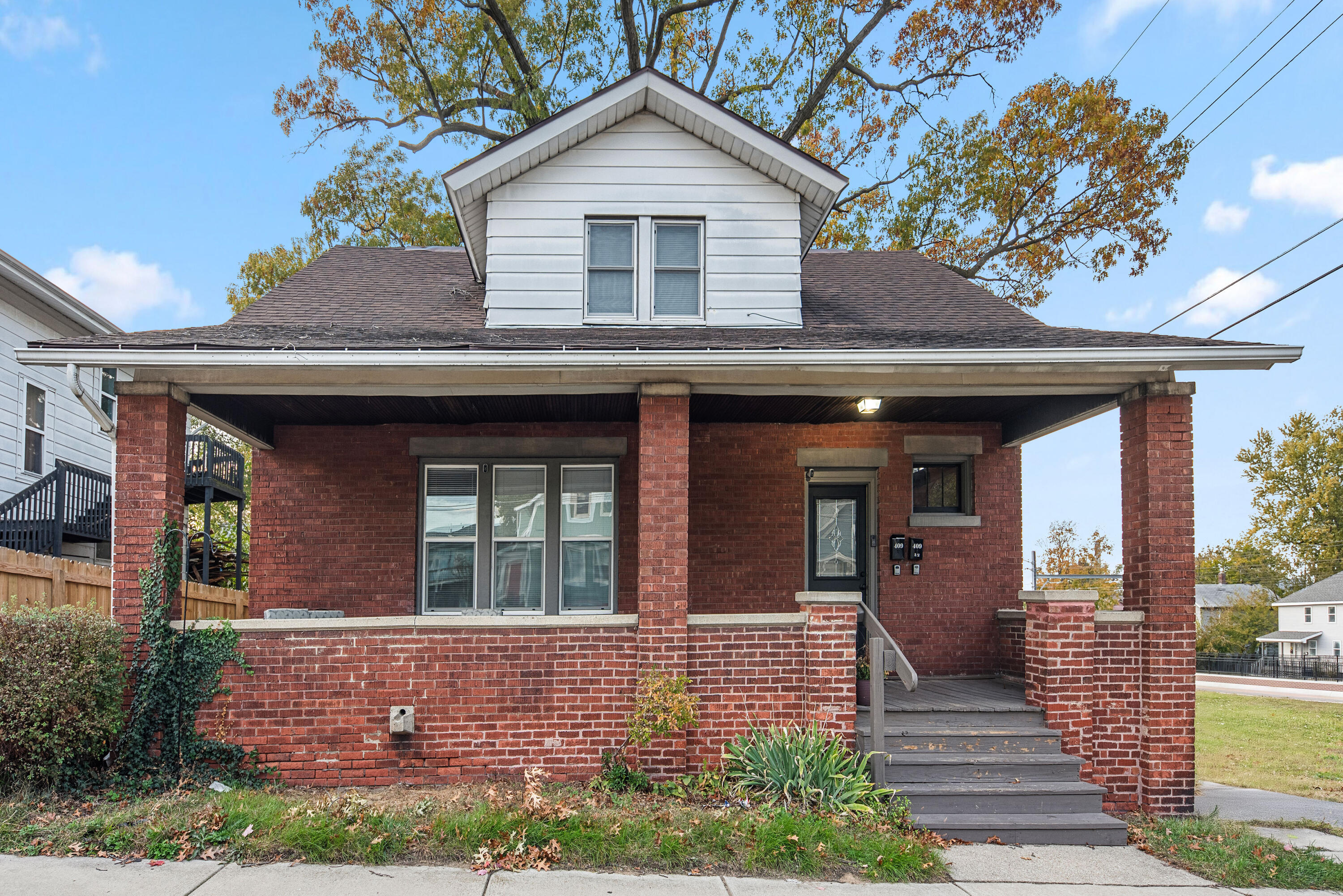 a front view of a house with yard