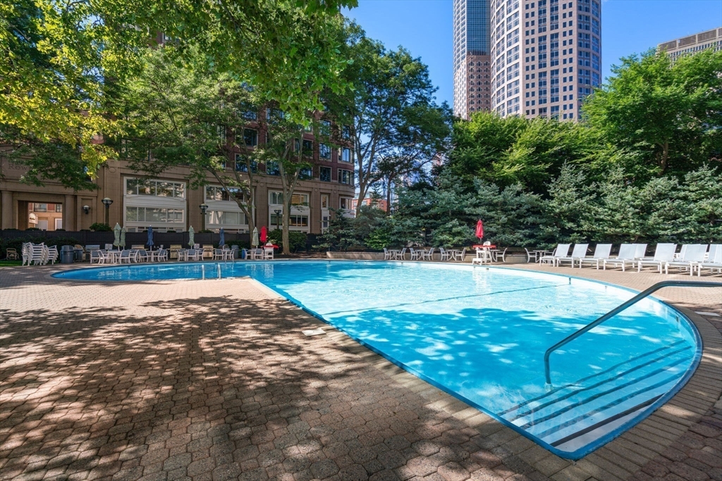 a view of a swimming pool with a patio