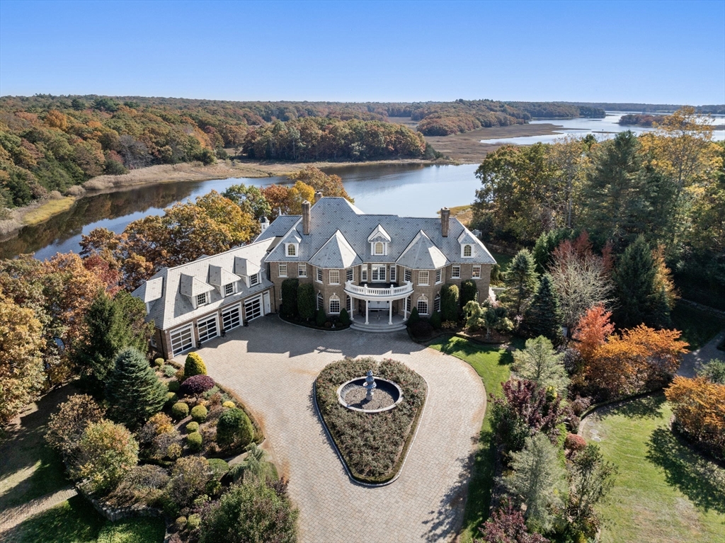 an aerial view of a house with a lake view